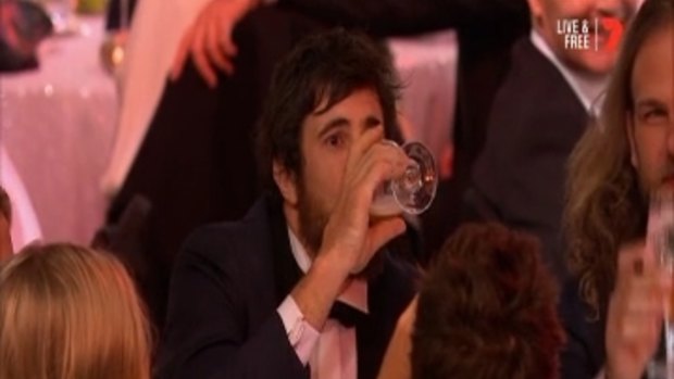 West Coast Eagle star Josh Kennedy downing another drink after polling two votes in Round 22. 