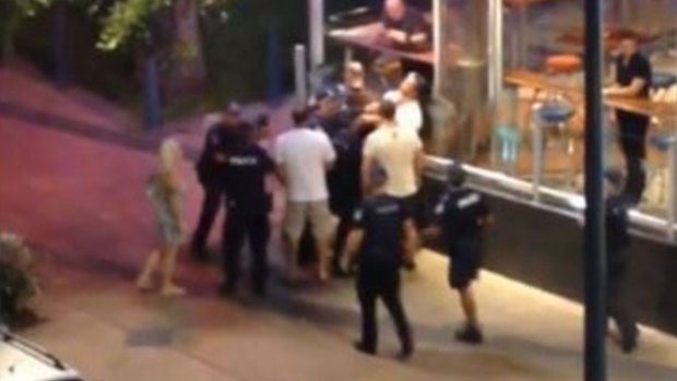 A screenshot of the footage arrest at the Gold Coast, in which Ray Currier appears to be struck several times by police.