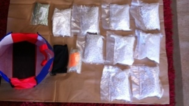 Dawn raids across south-east Queensland net 3kg of ice, plus ecstasy, cash and weapons.