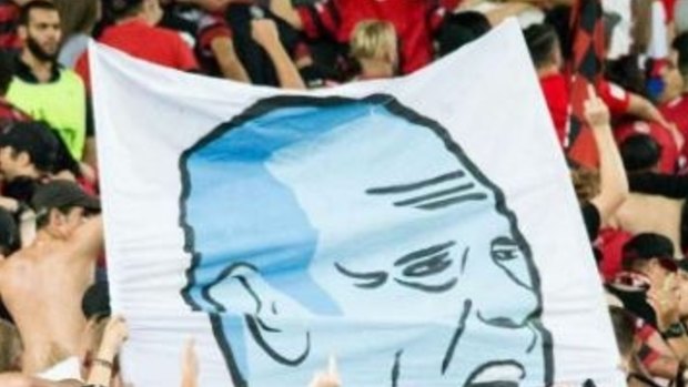 A section of the tifo featuring a likeness of Sydney FC coach Graham Arnold performing a sex act.