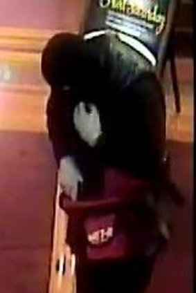 A man in a balaclava threatened staff at the Mawson Club on Monday morning.
