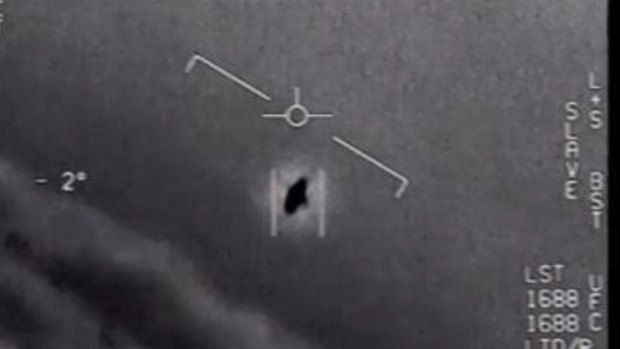 An image from a video released by the US Defence Department's Advanced Aerospace Threat Identification Program shows a 2004 encounter near San Diego between two Navy F/A-18F fighter jets and an unknown object. 