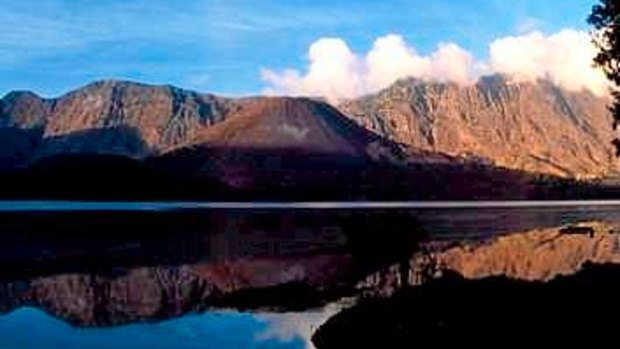 Mount Rinjani spews clouds of gas on Lombok island, east of Jakarta, Indonesia.  