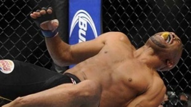 Anderson Silva in pain after a kick went wrong at UFC 168.