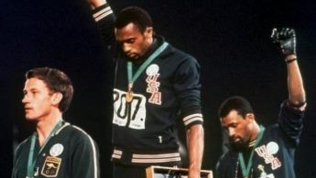 Australia's Peter Norman (left) joins American athletes Tommie Smith and John Carlos on the podium during the famous "Black Power" demonstration.