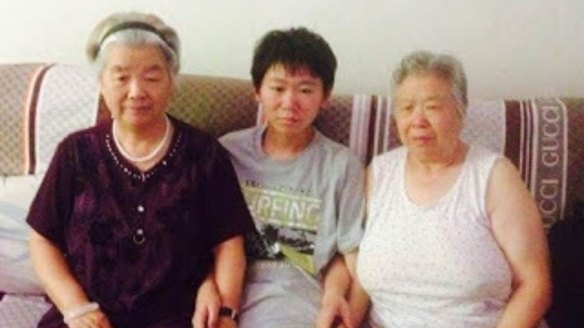 Bao Zhuoxuan pictured with his grandmother Tong Yanchun (right) in an undated photograph.