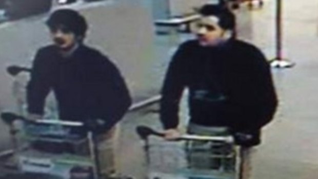 Two of the suspected bombers captured on CCTV footage minutes before the fatal blasts at the airport. Police are searching for the man on the right. 