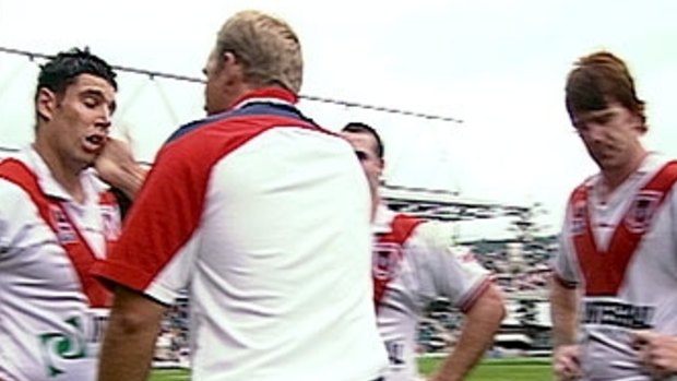 The slap: Nathan Brown gives Trent Barrett a touch-up.