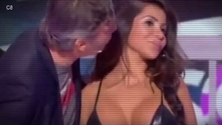 Anger after presenter kisses woman's breasts on live TV