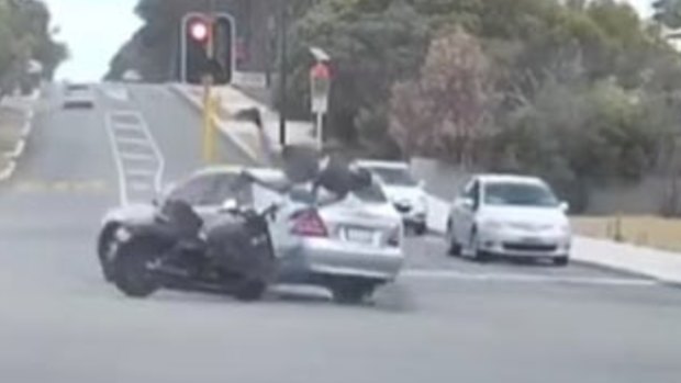 Dash cam video captures the moment a motorcyclist slams into a car in East Vic Park.