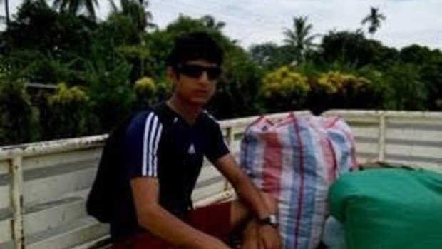 Refugee Loghaman Sawari, 20, pictured in Lae with all his possessions, wants to return to the relative safety of the Manus transit centre.