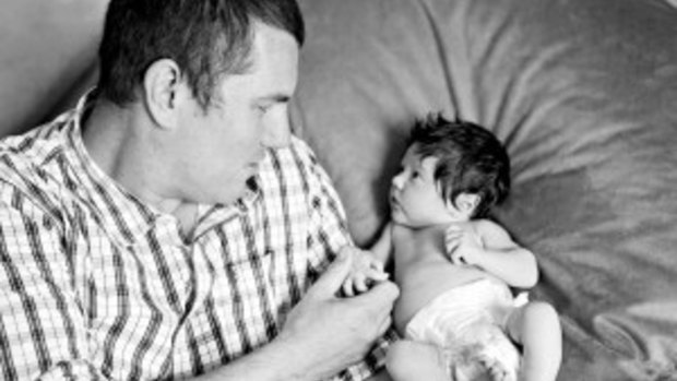 Kane Athol Bennett with his 12-week-old daughter Bella.