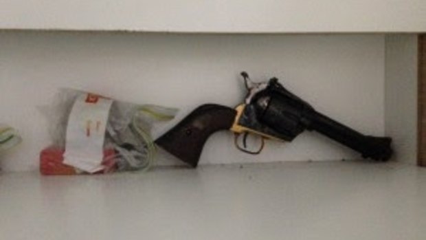 A handgun found during police raids on the Sunshine Coast.