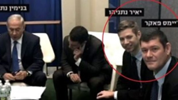 A screengrab from Israeli television shows James Packer, right, with Benjamin Netanyahu's son Yair (second from right) at a meeting with Israeli Prime Minister Benjamin Netanyahu, left.