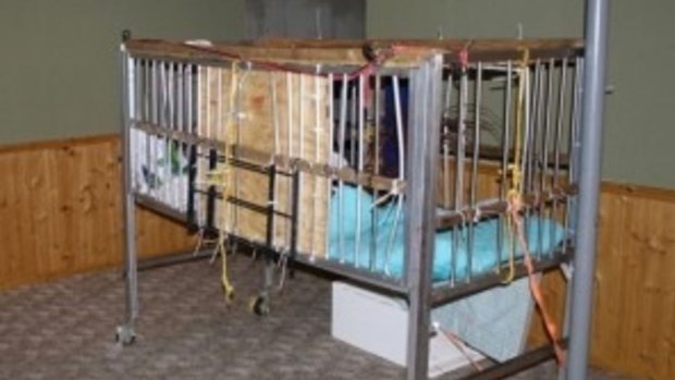 A six-year-old autistic boy in O'Fallon, Missouri, was kept in this cage, according to police.