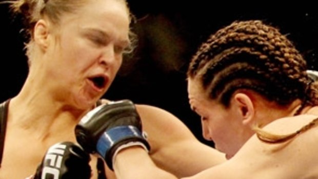 About-face: Ex-Olympic judo medallist Ronda Rousey helped change attitudes towards female UFC combatants.
