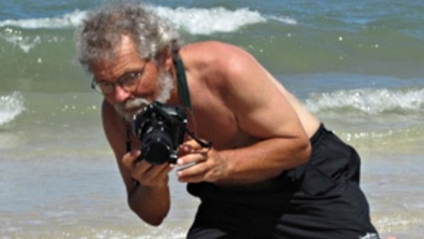 Environmental photojournalist Gary Braasch photographing sea turtles in Mexico.