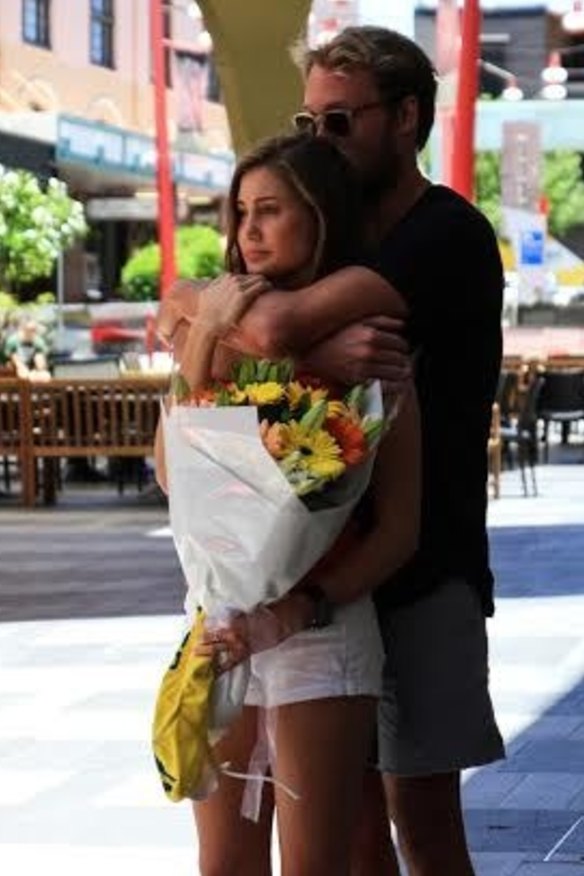 Cole's brother Billy, an Australian water polo player, mourns his brother at a service in Chinatown Mall.