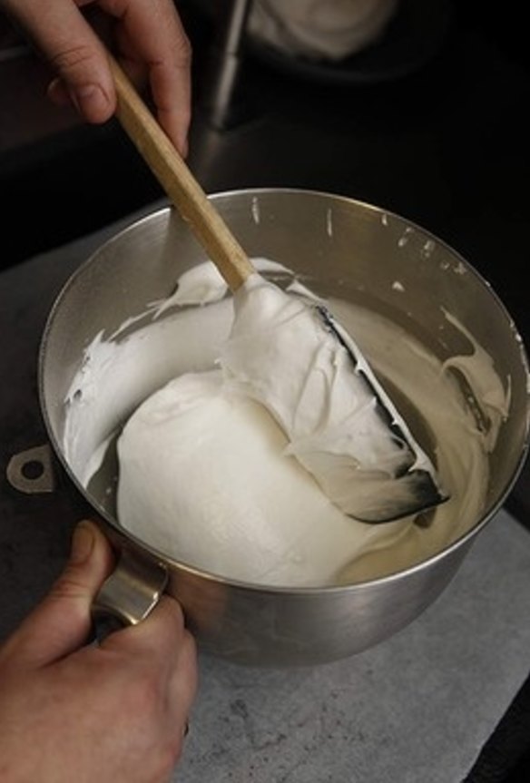 6. After sprinkling the cornflour, use a clean spatula to gently fold the flour through the mixture. No more than six folds