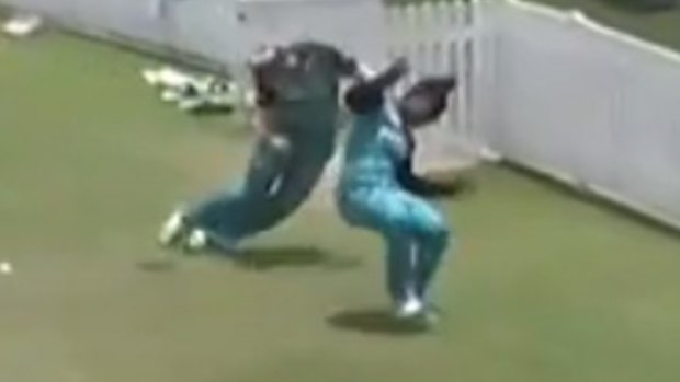 Dottin and Harris collide at full pace as they try to prevent a boundary.