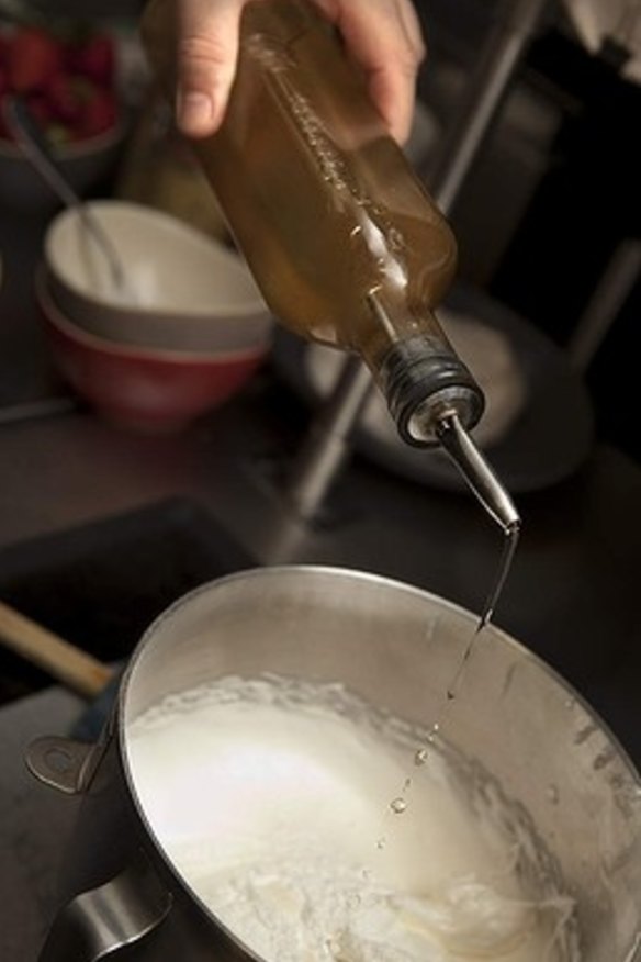 5. Slow the machine, add vinegar and let the beaters make three more rotations before removing bowl from the mixer