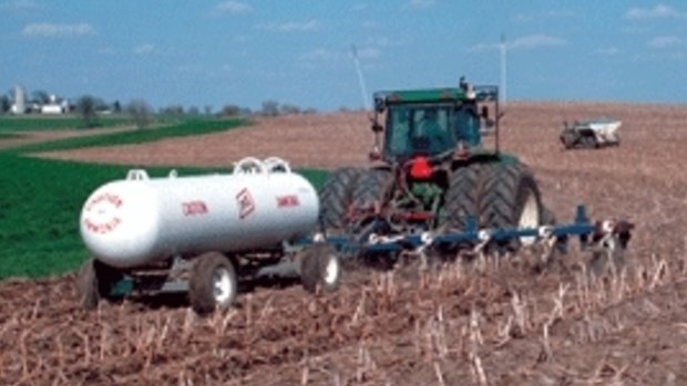 A farmer applies anhydrous ammonia to a field.