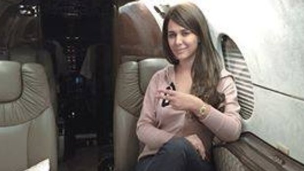 Ayyan Ali poses for a picture on a plane that was posted on her Facebook page in November 2014.