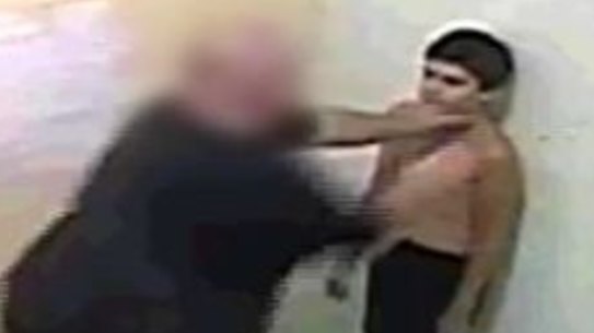 Officers restrain a youth detainee in the Northern Territory in 2010.