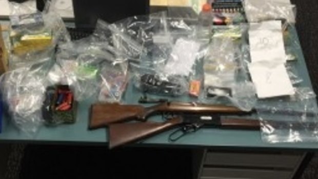 Guns were among items seized from an alleged Mongols associate.
