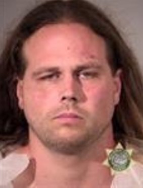 A booking photo provided by Multnomah County Sheriff's Office shows Jeremy Joseph Christian. 