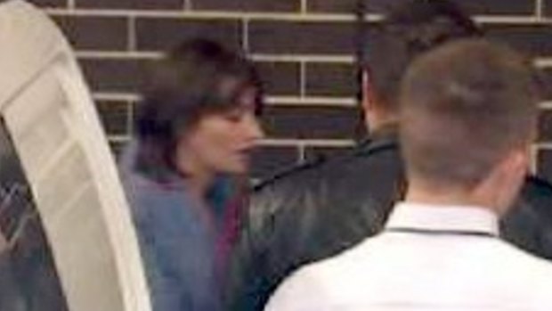 Harriet Wran, charged with murder over Mr  McNulty's death,  is led to Liverpool Local Court.