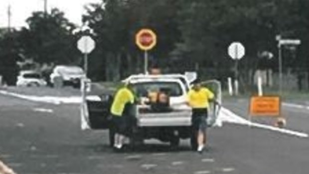 Police released images over a scam in which two men posed as road workers and ripped off elderly homeowners.