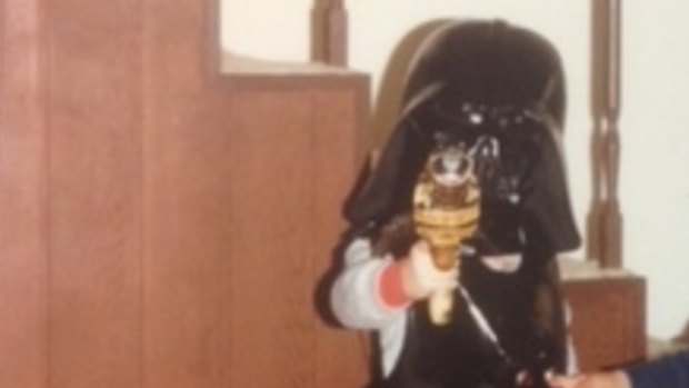 Iconic costume piece: Chris in the Darth Vader helmet.
