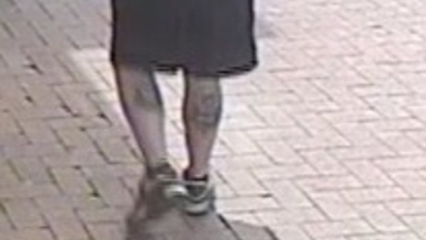 Visible tattoos on the calves of a man police want to speak to over an assault at an ATM in Borrack Square, Altona North.