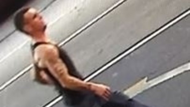 The man police would like to speak to was wearing a black singlet, jeans and runners.