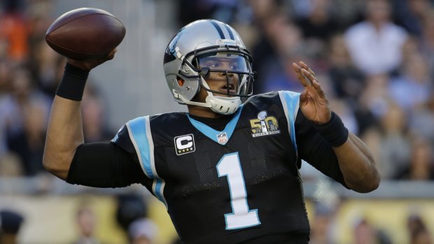 Superbowl 50 NFL MVP Cam Newton wears gold cleats with statistics
