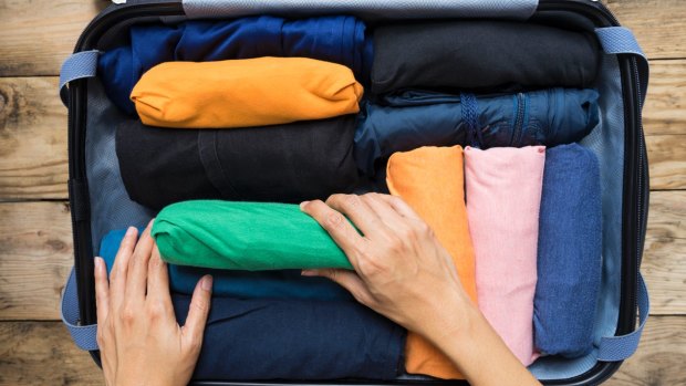 Rolling sweaters for packing sale