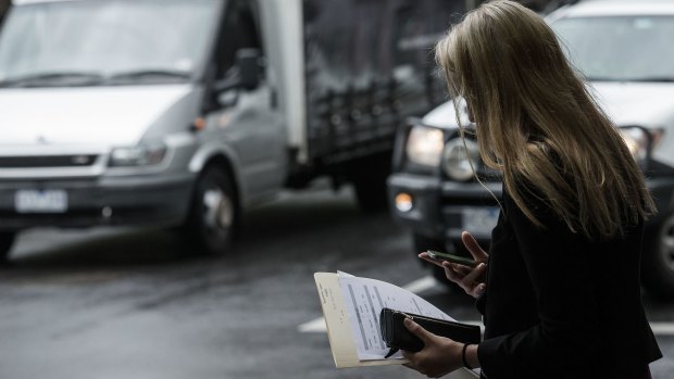 Pay attention: Pedestrians are being told to watch the road, not their phones.