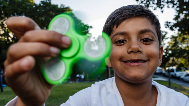 Kid with fidget spinner discount