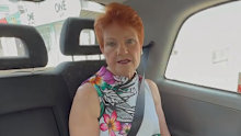 Hanson received criticism for being overseas rather than dealing with issues within her party.