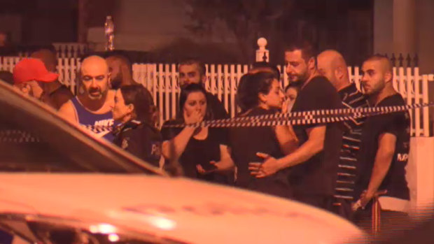 People gather at the Epping scene where underworld figure Nabil Maghnie was gunned down.