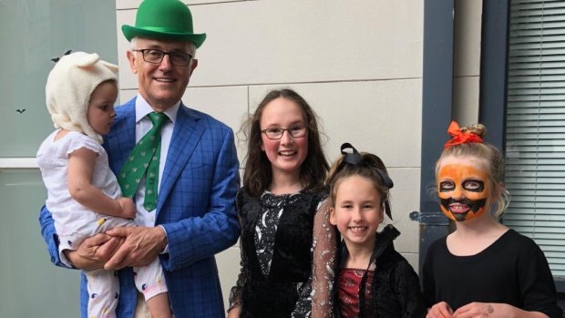 Former prime minister Malcolm Turnbull with Astrid Gardan, Saskia Gardan and Sofia White, trick or treating for Halloween. 