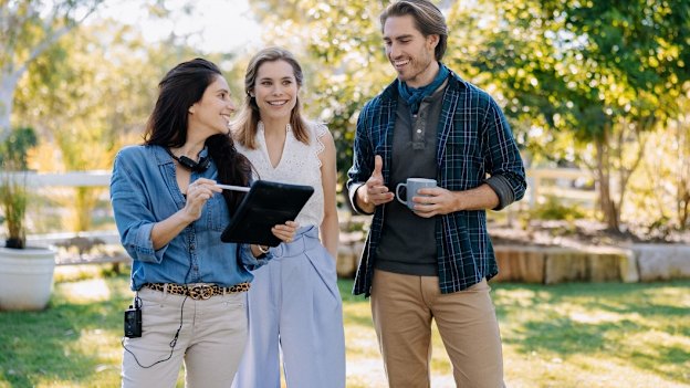 Rubin and actors Susie Abromeit and Julian Haig on the set of Love In Bloom. The film’s producer hired Rubin to direct the Australian romcom after being “impressed by her can-do attitude and moral compass”. 