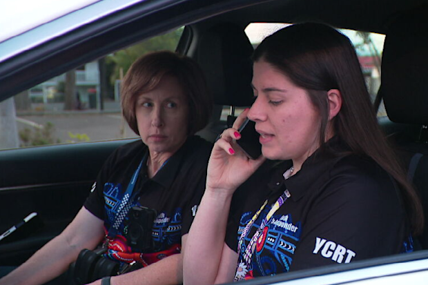 Team leader Brooke Sanders and Sergeant Belinda Goodsell make a call to the family of a child who had a run-in with police a few months ago.