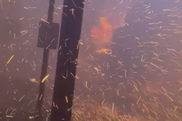 In this photo provided by Bosco Jr Bae flames from the wildfires fill the sky on Front Street in Lahaina, Hawaii.