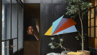 A meeting room in Flack Studio features the work of Sydney Ball, set off with a moody portrait by Darren Sylvester.