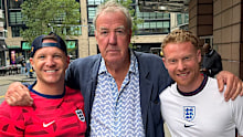 Jeremy Clarkson with two fans after giving away two tickets to the England v Ghana World Cup match
