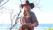 Brooke Atkins and her cow, Matilda surprised beachgoers with a visit.