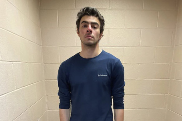 Luigi Mangione in custody at the police station in Altoona, Pennsylvania.