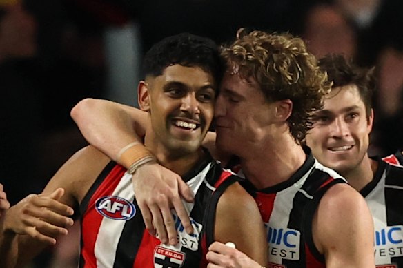 Nasiah Wanganeen-Milera is thanked by teammates after spearheading St Kilda’s win over Melbourne on Sunday.